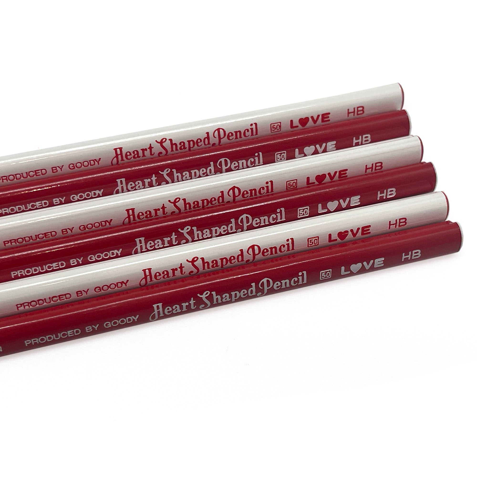 Heart-shaped pencils with red and white coloring on a white background