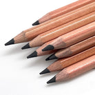 Stack of 12 Jolly Kinderfest pencils with HB graphite (#2 pencils) for writing and drawing. The photo shows the detail of the thick, break resistant, pencil leads.