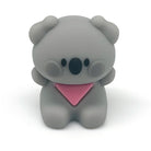 A small gray koala pencil sharpener wearing a pink bandana, centered on a clean white background.
