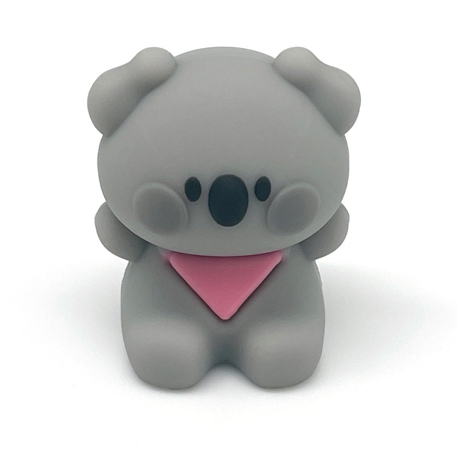 A small gray koala pencil sharpener wearing a pink bandana, centered on a clean white background.