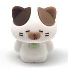 A small white cat pencil sharpener with brown ears, a brown nose, and a light green bow tie, centered on a plain white background.