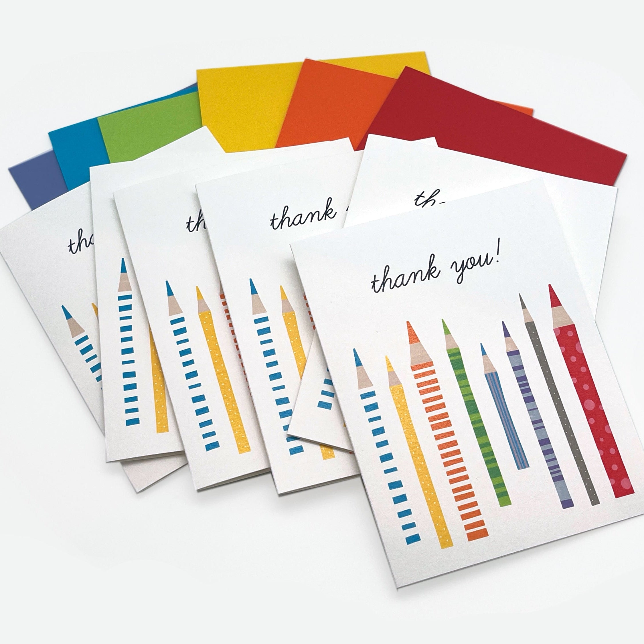 Set of 'thank you' cards with colorful pencil designs on a white background