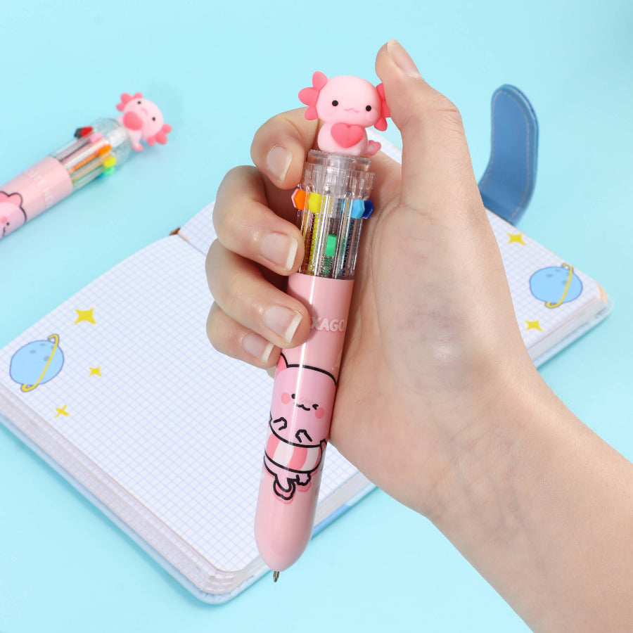 Hand holding a colorful click pen with a pink axolotl on a light blue background
