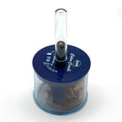 A very stubby black wood rainbow pencil with a clear plastic pencil extender set in a blue color-combi KUM pencil sharpener on a white background.