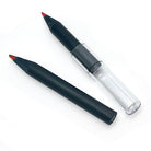 Two very stubby black wood rainbow pencils one has a clear plastic pencil extender and both show the multi-color rainbow tips on a plain white background.