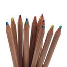 A close-up of a dozen cedar wood colored pencils with multi-color rainbow tips fanned out against a plain white background.