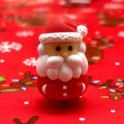 Mini Santa eraser on a red Christmas theme background with reindeer and snowflakes