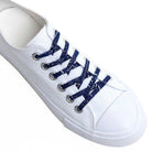 White sneaker with blue bandana laces on a white background