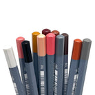 Set of 12 skin tone colored watercolor pencils end tips against a white background