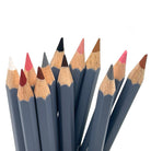 Set of 12 skin tone colored watercolor pencils against a white background