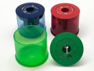 KUM jumbo sharpeners to sharpen wax crayons or jumbo pencils (blue, red, green) on a white background.