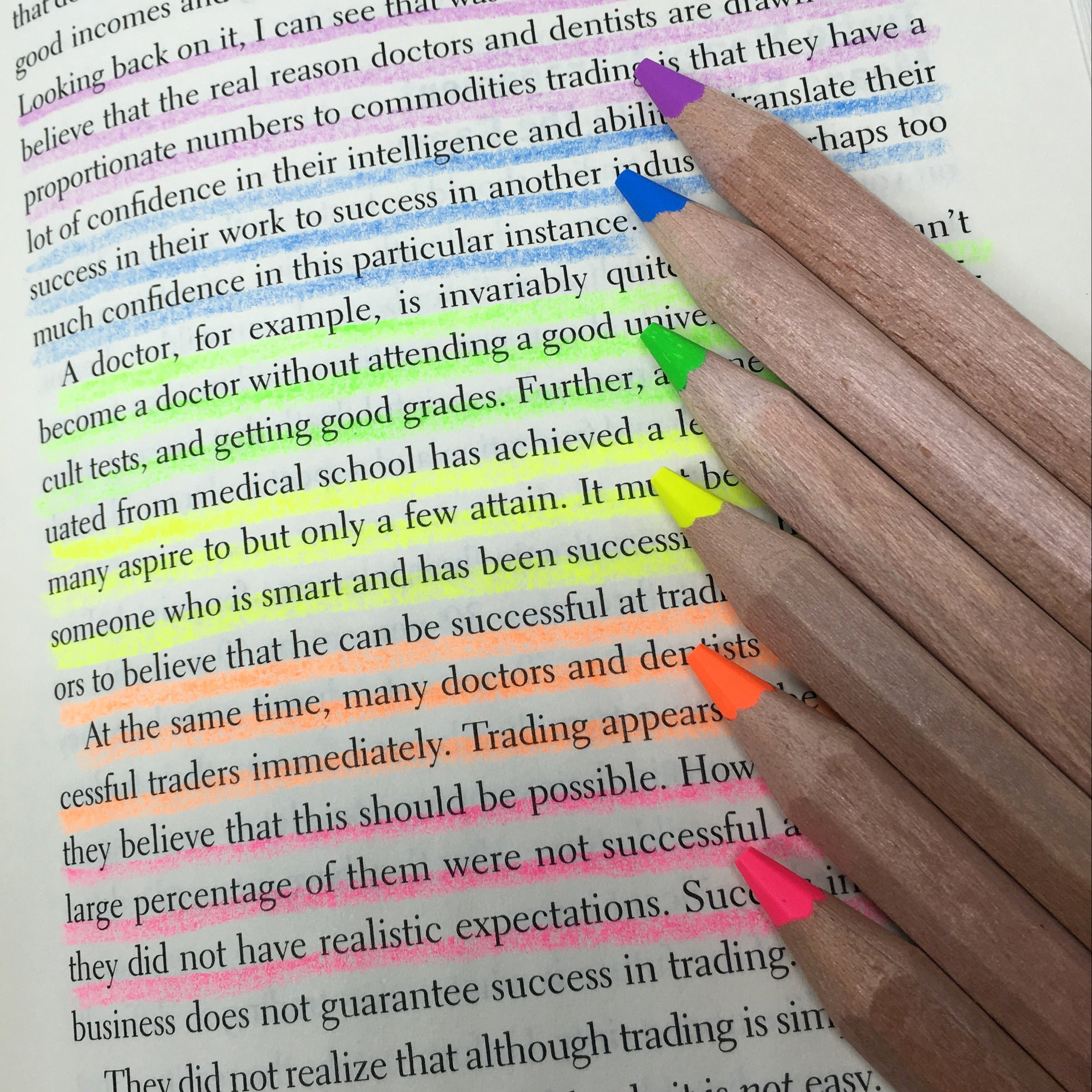 Set of pencils highlighters from Stubby Pencil Studio showing how they can highlight thin pages without leaking or bleeding. 