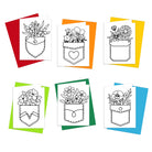 A set of six coloring greeting cards with floral pocket designs, each card is outlined and colored on a variety of colored envelopes