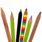 A sample set of multi-color rainbow pencils, featuring 1 of each: triangular rainbow pencil, rainbow superstick green tip, black wood rainbow pencil, 4-in-1 quad color rainbow stripe pencil, rainbow superstick purple tip, and a round barrel rainbow pencil with natural cedar finish displayed on a white background. 