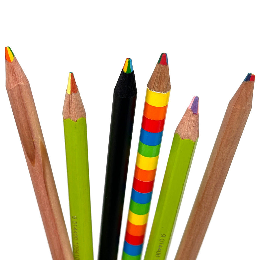 A sample set of multi-color rainbow pencils, featuring 1 of each: triangular rainbow pencil, rainbow superstick green tip, black wood rainbow pencil, 4-in-1 quad color rainbow stripe pencil, rainbow superstick purple tip, and a round barrel rainbow pencil with natural cedar finish displayed on a white background. 