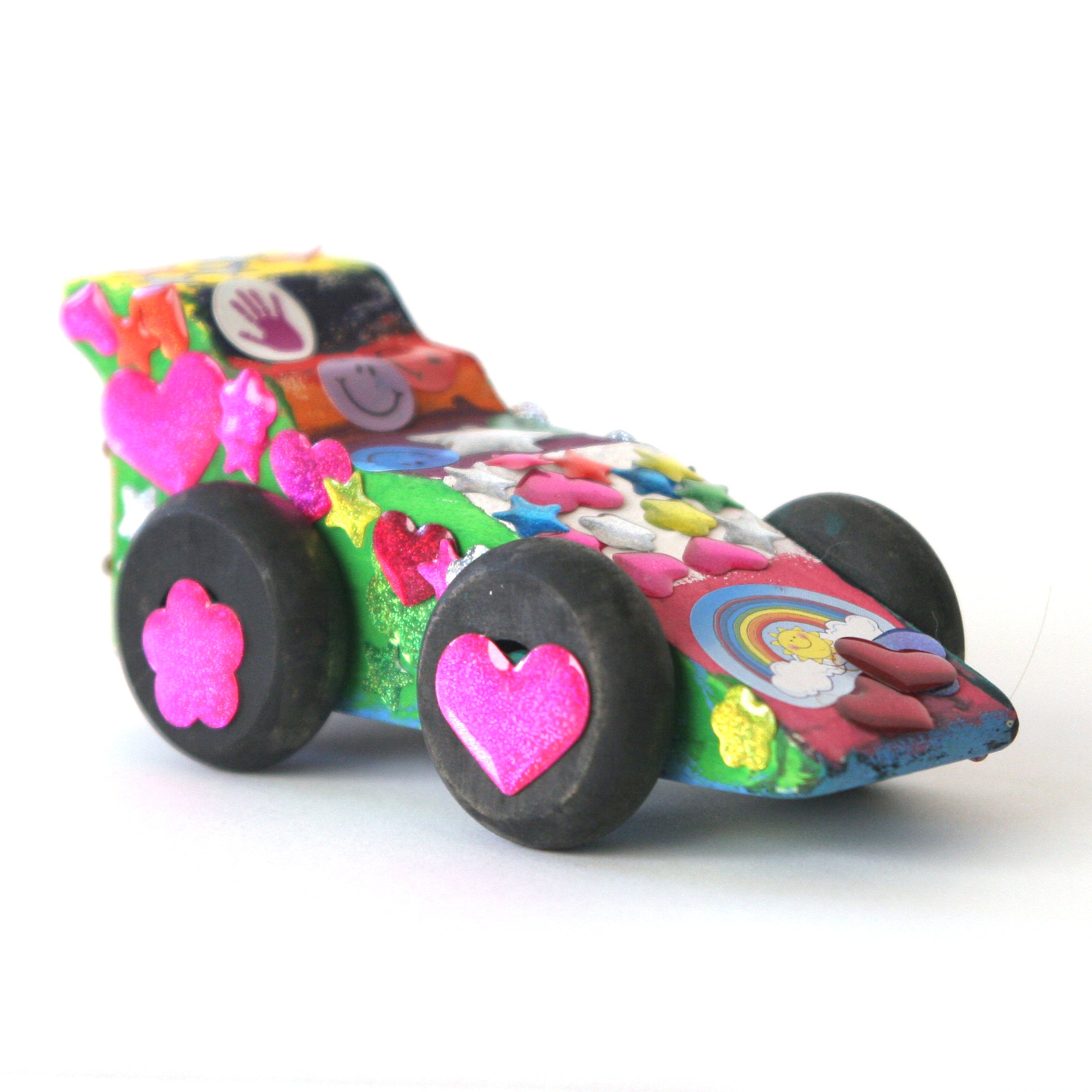Made by Me wooden race car all decorated with stickers and painted 